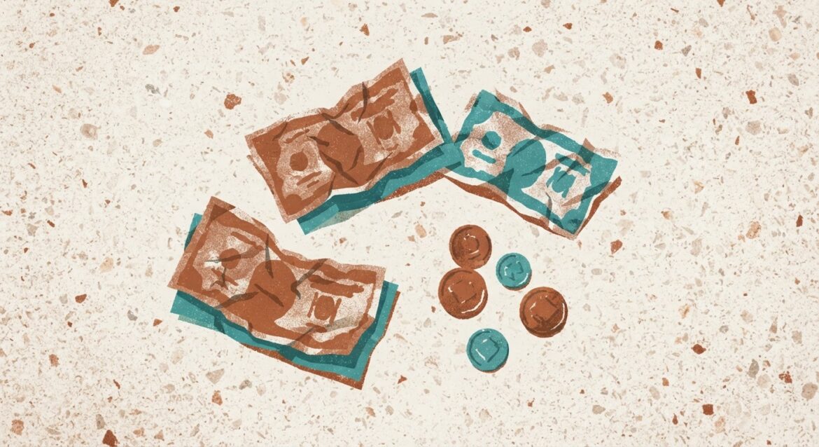 a few crumpled bills and coins on a countertop